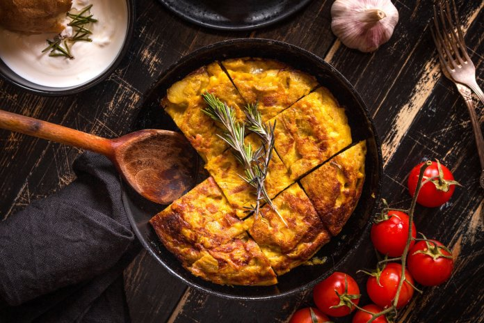 The Tortilla Española (or Spanish omelet) is a simple yet beloved dish and foods , made with eggs, potatoes, onions, and sometimes, chorizo or ham. This thick, hearty omelet is served in slices and can be enjoyed either hot or cold, making it a versatile staple in Spanish cuisine. It’s often served as a tapa, but also works as a satisfying meal on its own.