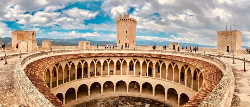 Bellver Castle is a circular castle located on a hill just outside Palma, offering breathtaking panoramic views of the city and the Mediterranean Sea