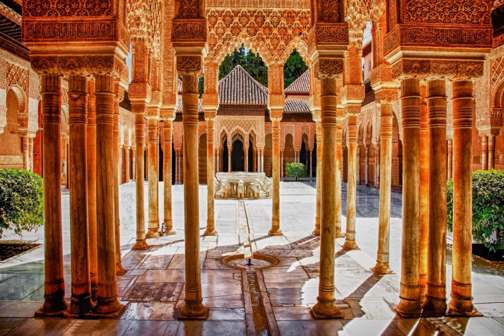 Morning: Take an early morning bus or train to Granada, with tickets ranging from €20–€35. Granada is a city famous for its Moorish heritage, stunning palaces, and vibrant student life.