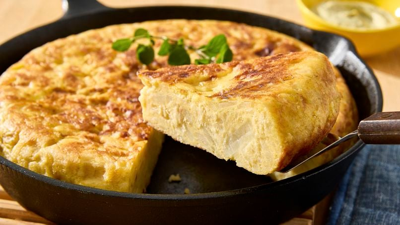 Tortilla Española, or Spanish omelette, is a simple yet beloved dish found throughout Spain. Made primarily of eggs, potatoes, and onions (although some regions prefer to omit the onions), the tortilla española is often served as a tapa, sliced into wedges, and enjoyed either hot or cold. It’s a staple in Spanish households and can be found in nearly every bar and café across the country.