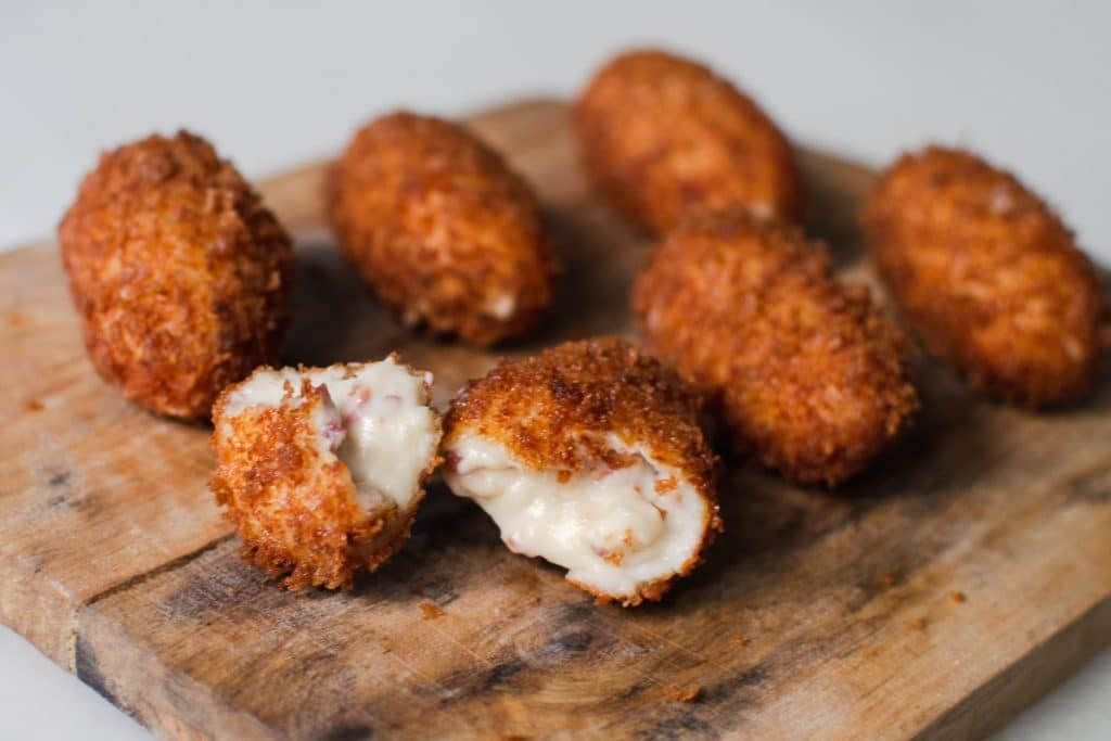 No Spanish tapas bar is complete without croquetas—deep-fried, breaded rolls filled with béchamel sauce and various ingredients such as ham, chicken, or cod. Croquetas are crispy on the outside and creamy on the inside, making them an irresistible snack or side dish.