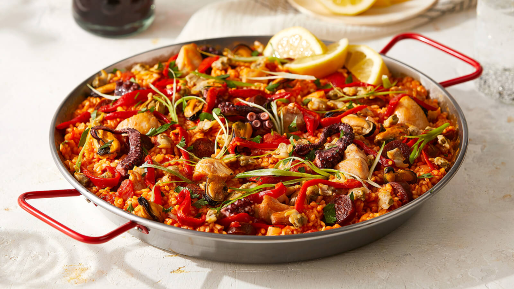 No discussion of Spanish foods is complete without mentioning paella, the quintessential dish from Valencia. Originally a farmer’s meal, this flavorful rice dish has become synonymous with Spain’s culinary identity. Traditionally made with rabbit foods